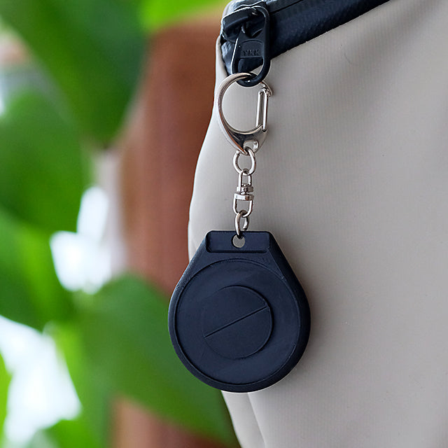 TapTags for Leica Monochrome street photographers keyring attached to camera bag