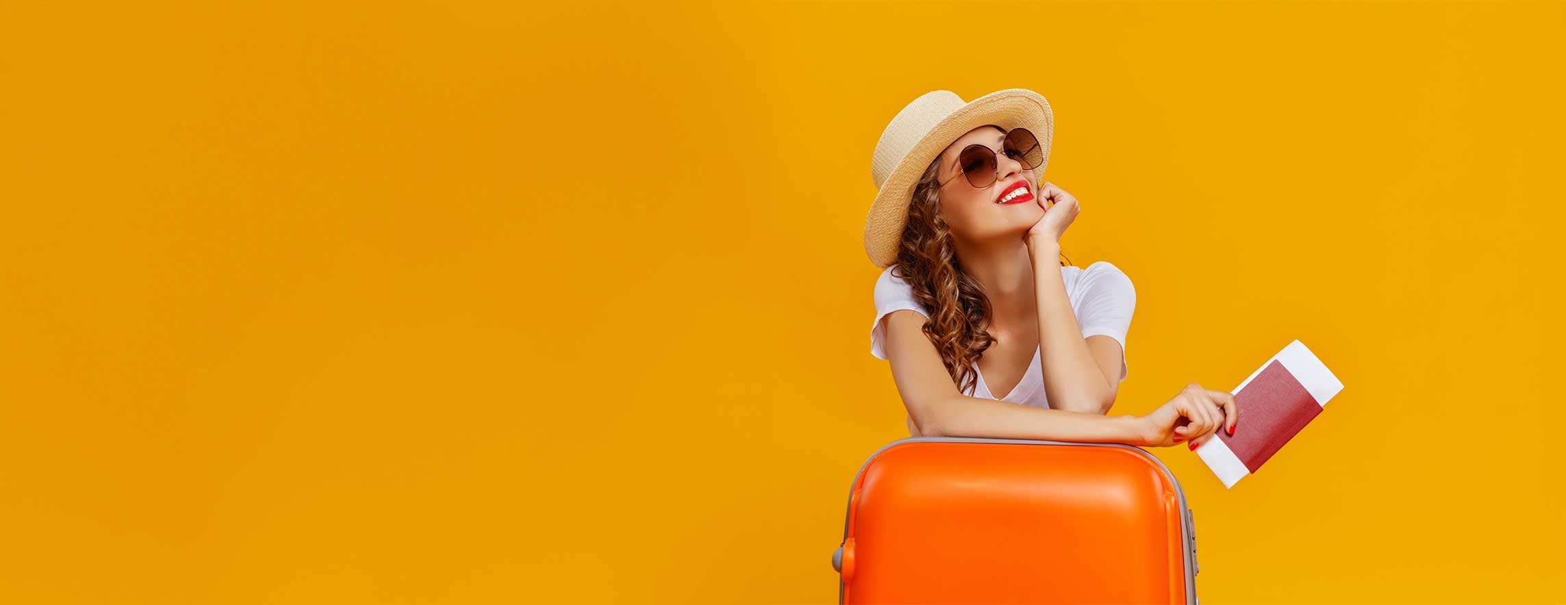 woman with suitcase and passport dreaming about travel